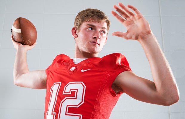 Katy quarterback Garrett Doiron poses during his team's photo shoot on May 13.
