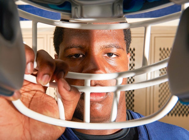 Mallard Creek lineman Grant Gibson looks through a face mask.