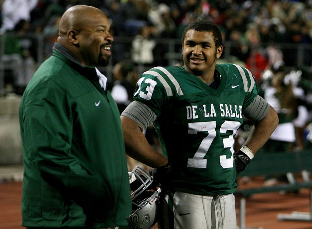 Larry Allen Jr. (left), who was just inducted into the NFL Hall of Fame over the summer, enjoys a moment with his son Larry III during a De La Salle football game.
