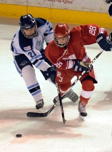 Regis Jesuit's Brendan Carlstrom (28)
battles Ralston Valley's Sean Teater.