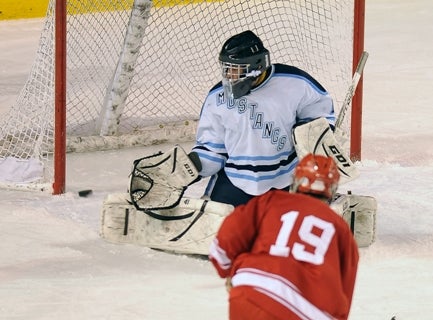 Ralston Valley goalie Kyle Piersky can't turn away a shot by Regis 
Jesuit's Nolan Carothers in the second period.