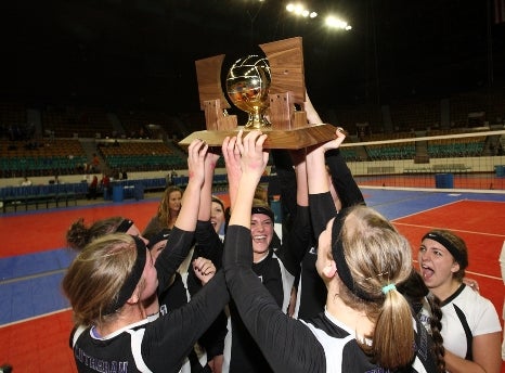 Lutheran celebrates after winning its second consecutive Class 2A state title. The Lions beat Simla 3-1 in a matchup of unbeaten teams Saturday at the Denver Coliseum.