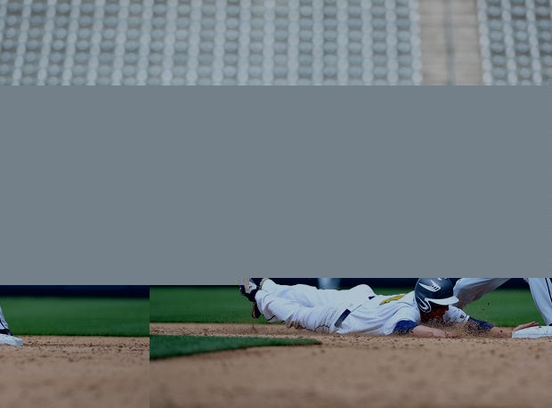 An Evergreen player dives back to second base.