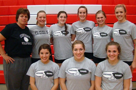 Cheshire volleyball coach Sue Bavone, left, and her eight senior girls. Bavone is attempting to go undefeated with both the boys and girls teams at Cheshire in 2011.