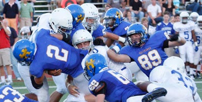 Hutchinson's Ben Heeney (2) can't find much running room. 