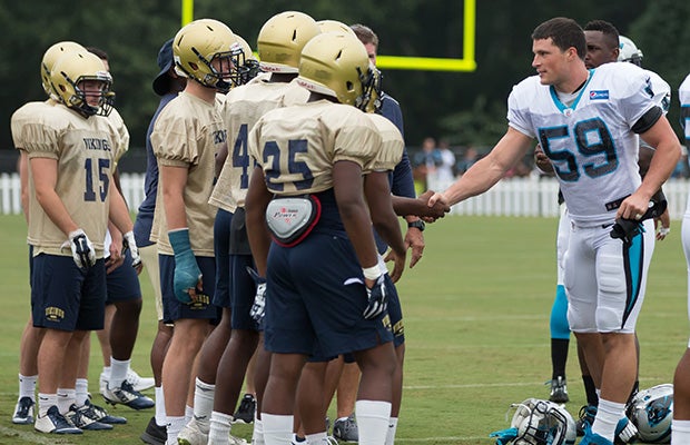 Carolina Panthers linebacker Luke Kuechly greets some of the Spartanburg players.