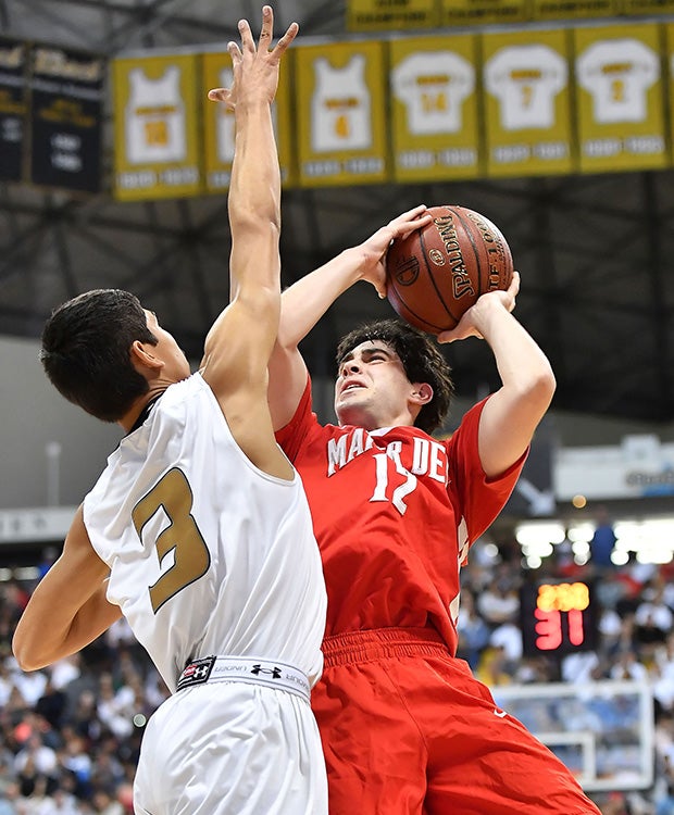 Mater Dei guard Spencer Freedman takes a jump shot in front of Bishop Montgomery's Josh Vazquez.