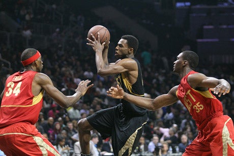 No. 1 recruit Andrew Wiggins drives through the lane.