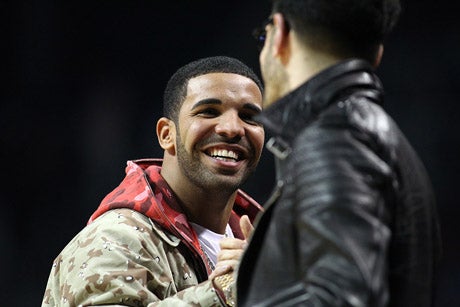 Recording artist Drake shaking hands with a fellow high school basketball fanatic.