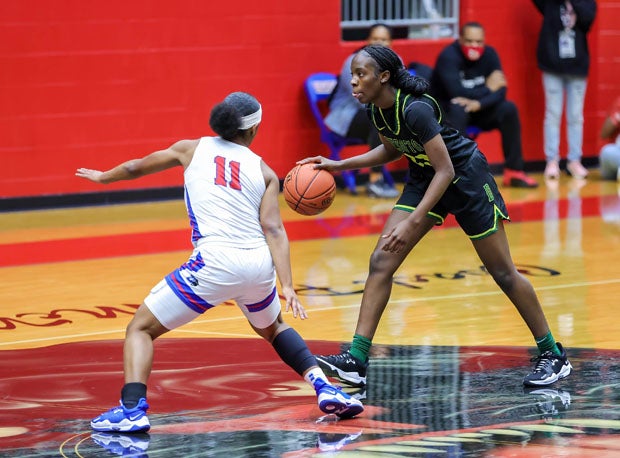 Duncanville's Tristan Taylor (left) guards DeSoto's Nisaa Muhammad during a Dec. 21 meeting.