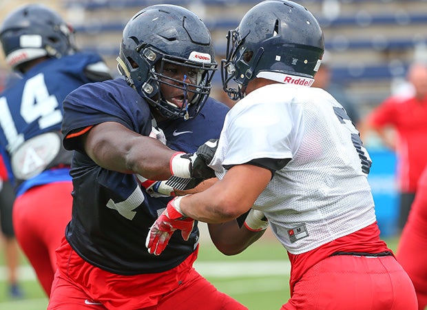 Offensive guard E.J. Ndoma-Ogar (left) sqaures off with a teammate during spring drills.