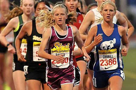 Freshman Sarah Baxter (left) in the early stages of her remarkable 3,200-meter victory over a talented field.