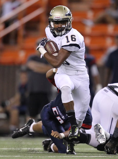 Terrence Beasley carries the ball for St. John Bosco.