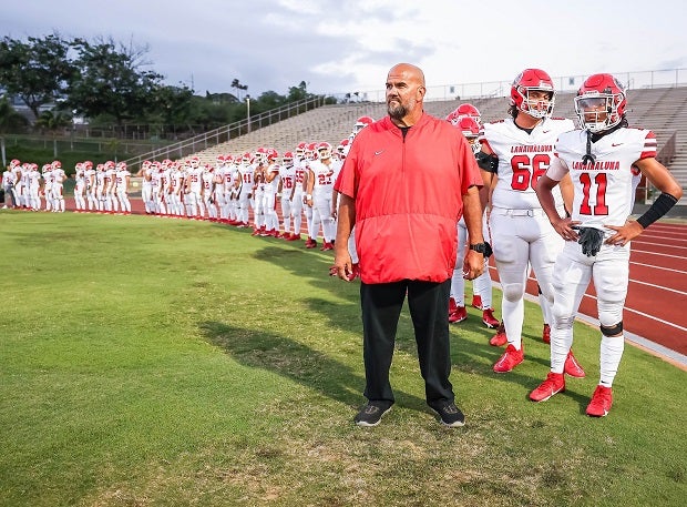Lahainaluna coach Dean Rickard stands with his football team before an Oct. 4 game against Baldwin. It was the first game for the Lunas following the deadly fire that destroyed most of Lahaina in August and the return of sports to the Maui town helped bring some normalcy to the students and town. (Photo: Brian Bautista)
