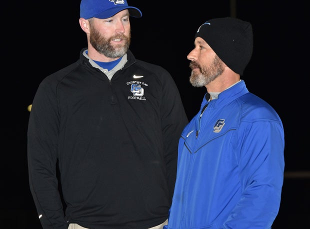 Special Teams Coordinator Robert Grasso (right) talks with coach Hales.