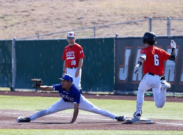 Americas first baseman Andres Lopez stretches for the throw on a bang-bang play to get Rockwall's Dylan Cheek at first. (Photo: Michael Horbovetz)