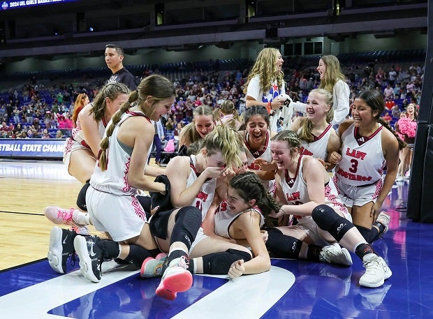 Martin’s Mill players celebrate after hitting a buzzer beater to win the UIL 2A state title against Nocona at the Alamadome Dome in San Antonio. (Photo: Robbie Rakestraw)