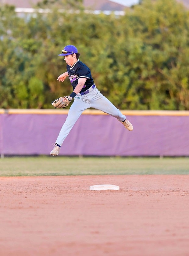 Lennard infielder Sebastian Rojas goes big air to try to snag an overthrown ball. (Photo: Francis Fedor)