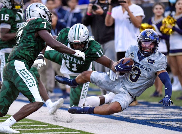 Central's Ruben Bain (11) and Alfonzo Allen (7) lower the boom in this hard-hitting tilt.