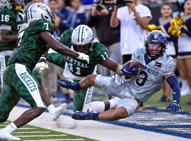 Central's Ruben Bain (11) and Alfonzo Allen (7) lower the boom in this hard-hitting tilt. 