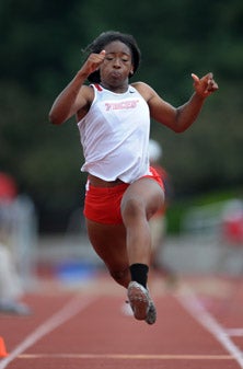 Jennifer Madu, who placed second,
in the 100, won the triple jump. 