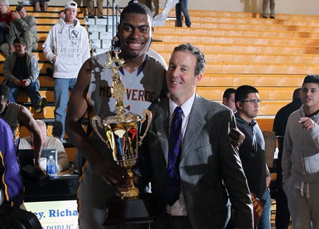 Tournament MVP Dakari Johnson and head coach Kevin Boyle celebrate Montverde Academy's championship game victory over Lone Peak at the City of Palms Classic.