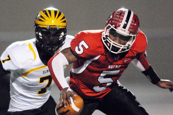 Ifeadi Odenigbo, shown chasing down current Ohio State player Braxton Miller, is a late bloomer at defensive end. The son of Nigerian parents has kept his recruiting options open.