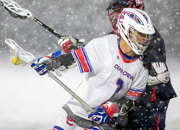 Cherry Creek (Colo.) midfielder Connor Terrell dodges from behind the goal on his way to scoring his fourth goal in his team's 12-7 victory in near whiteout conditions in the CHSAA 5A championship game at All-City Stadium in Denver.