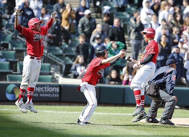 Lake View (Ill.) players celebrate their three-run, subsequent game-winning runs in the top of the seventh inning during the Chicago Public League championship game against Jones College Prep at Guaranteed Rate Field, home of the Chicago White Sox.