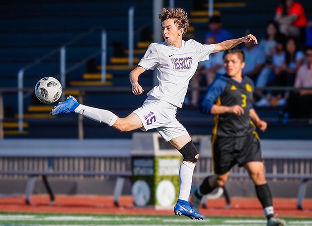 Paolo Fichera of Issaquah (Wash.) flicks a long kick during a WIAA 4A District playoff game against Mariner.