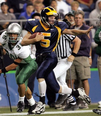 Sophomore quarterback Eric Block was brilliant in
his first varsity start. 