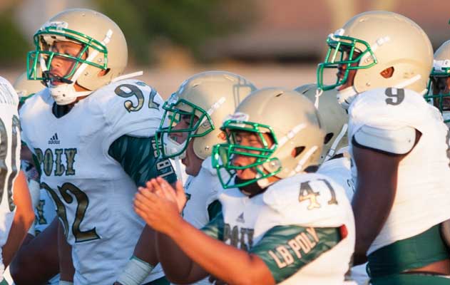 Long Beach Poly celebrated a season-opening victory againts Centennial (Peoria, Ariz.) in August.