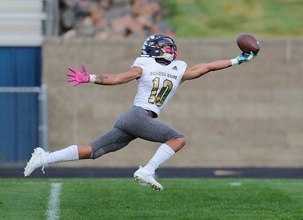 Receiver Marcellus Reed of Palmer Ridge  (Colo.) stretches for a one-handed reception against Golden.