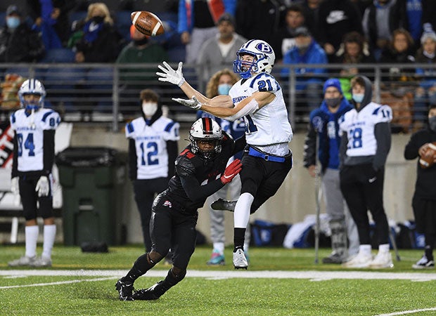 Receiver JD Serwatka of Brunswick (Ohio) makes a leaping catch while defended by McKinley cornerback Caleb Ruffin in a OHSAA D1 Regional Quarterfinal playoff game.  
