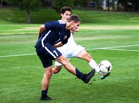 Evergreen junior Brock Anderson (blue jersey) went for the hat trick in the Class 4A state quarterfinals vs. Longmont. The state semifinals in all three classifications are Nov. 11.