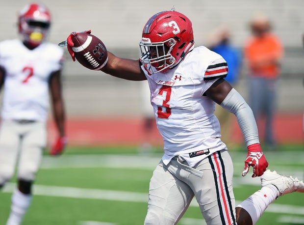 St. John's running back Ron Cook finishes off a 9-yard touchdown run that finished off Hoover.