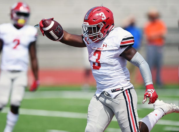 St. John's running back Ron Cook finishes off a 9-yard touchdown run that finished off Hoover. 