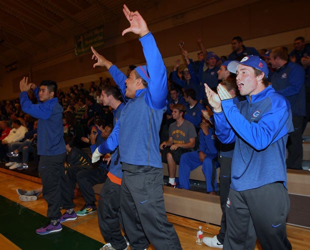 Nela Otukolo (middle) and Nikko Fertitta (right) celebrate another dunk by one of the Bishop Gorman big men Friday night at the Wild West Shootout in Reno, Nev.
