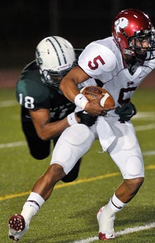 Central linebacker Dwight Jackson (18)
was everywhere on Friday night for
active Rockets' defense.