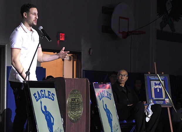Klay Thompson is honored Friday at Santa Margarita. Thompson’s father Mychal (right) – who spent over a decade in the NBA – looks on.