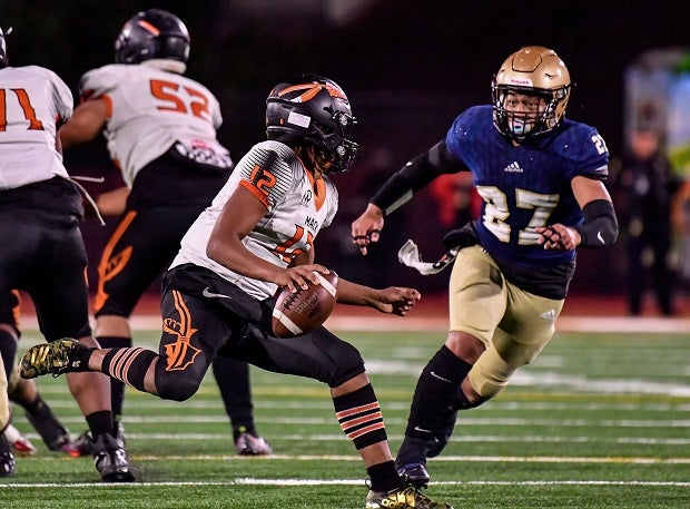 McClymonds quarterback Deontae Faison looks to make a play Friday in the CIF Division 2-AA finals against Mater Dei Catholic. Mater Dei Catholic won 26-18. (Photo: Louis Lopez)