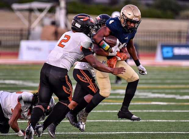 Ferrari Miller of McClymonds looks to bring down Mater Dei Catholic's D.J. Overstreet in the CIF Division 2-AA finals at Saddleback College. (Photo: Louis Lopez)