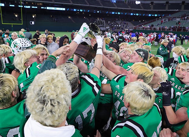 Southlake Carroll players celebrate their 6A Division 1 semifinal won over Duncanville on Saturday. The victory sets up a championship game with Austin Westlake and a battle between father and son head coaches.