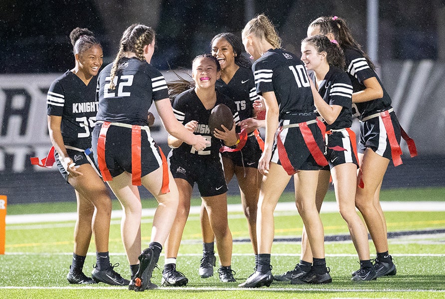 Junior Sarah Williams celebrates with her Robinson teammates after a touchdown during a March 25 game against Steinbrenner. The Knights seek a 10th straight state championship this season in the Class 2A bracket. (PHOTO: Patrick Duffey)