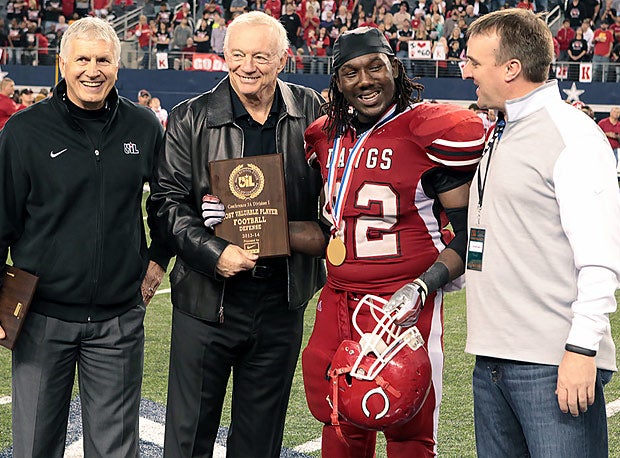 Cowboys owner Jerry Jones presents the MVP award.