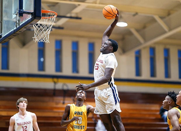 Ezemdi Udoh of Terry Sanford (N.C.) soars in for a dunk against Pine Forest.