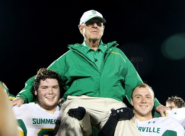 John McKissick is carried off the field by players after winning his 600th game in 2012. The winningest all-time football coach at any level died Thursday at 93.