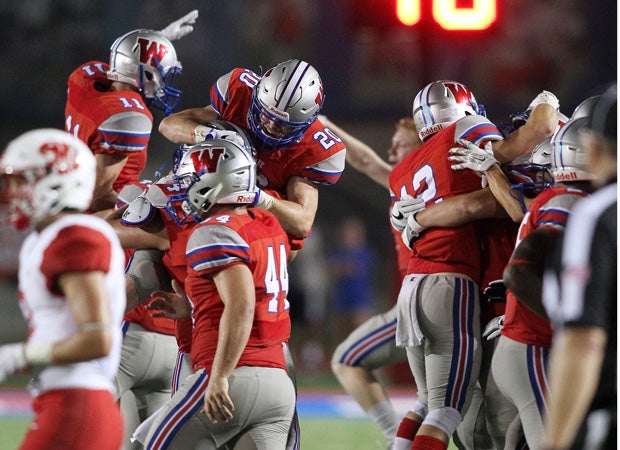 Westlake players celebrate as they defeated visiting Katy 32-29 on Friday night.