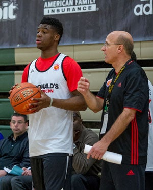 Frank Allocco coaches during early morning 
practice in front of NBA scouts. 