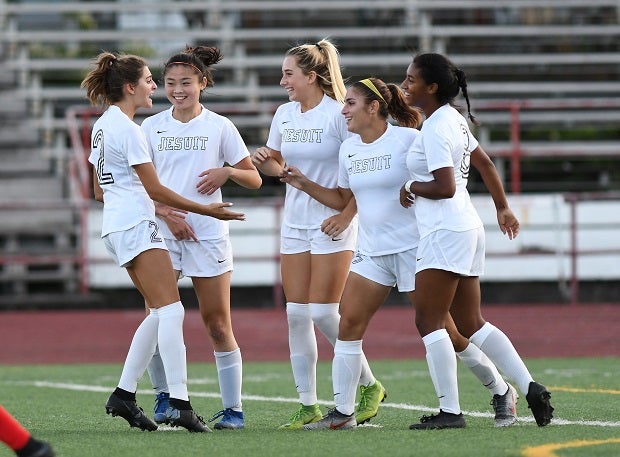 Jesuit players celebrate during a regular-season game on their way to an Oregon 6A title.